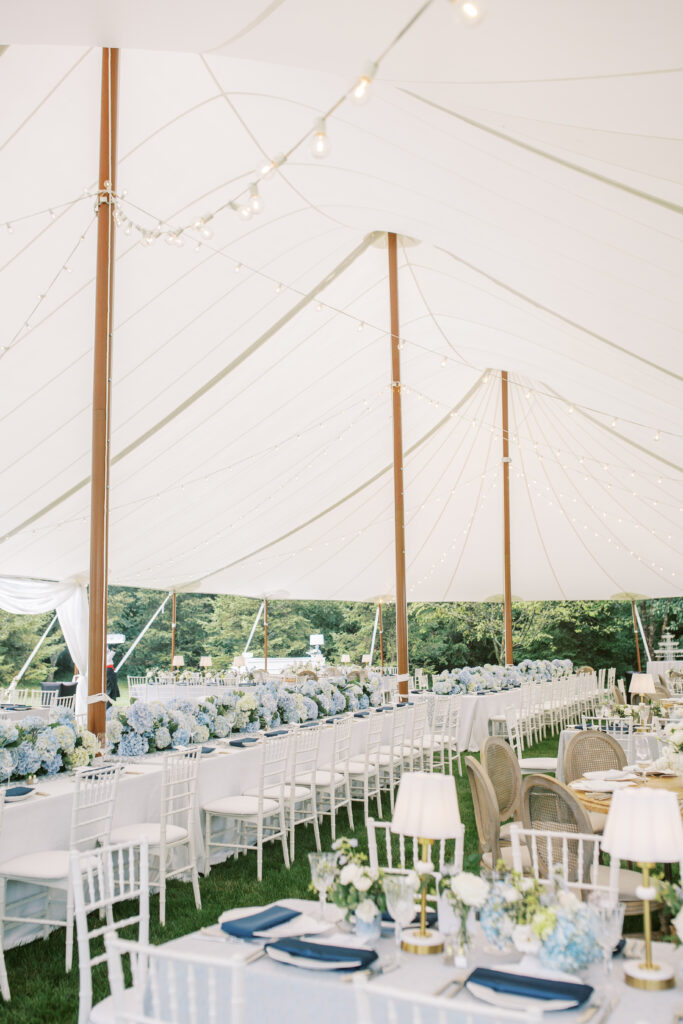 Aerial and scenic views of a luxury tented estate wedding in Ohio, featuring two sailcloth tents, poolside cocktail hour spaces, and detailed outdoor setups planned by an expert Ohio wedding planner.