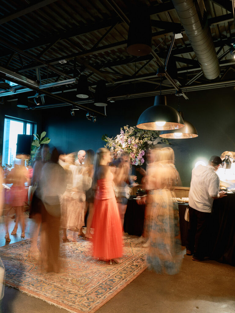 Bride and groom at their Junto Hotel wedding welcome party in Columbus Ohio celebrating at Brass Eye rooftop bar.