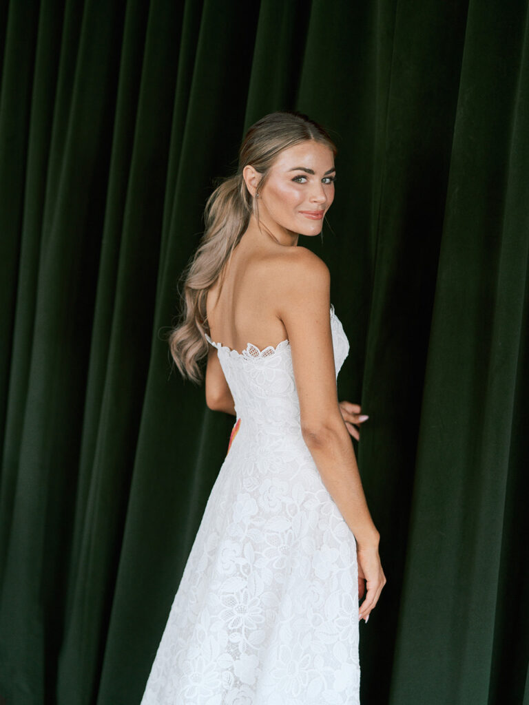 Bride and groom at their Junto Hotel wedding welcome party in Columbus Ohio celebrating at Brass Eye rooftop bar.