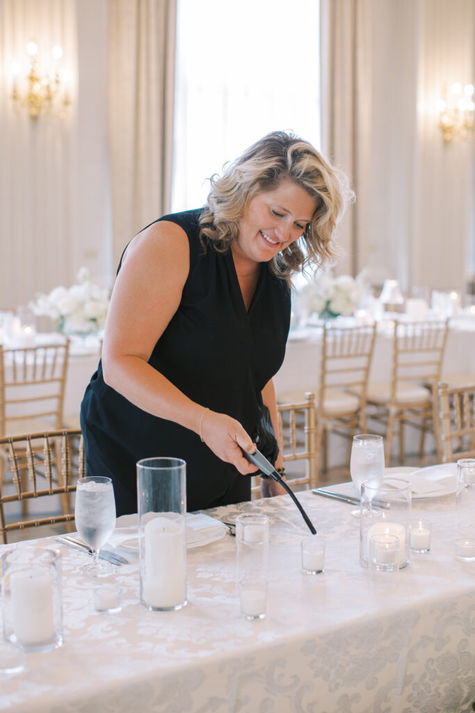 wedding coordinator lighting candles 